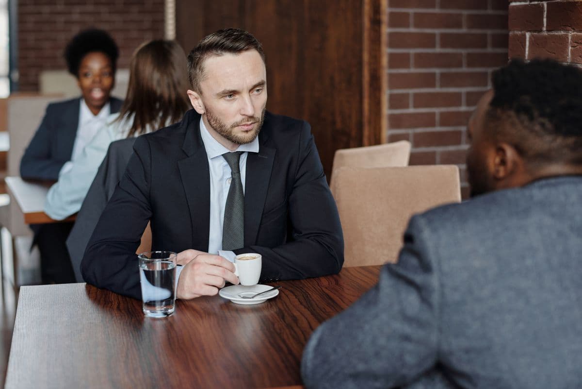 Two people in conversation across a table